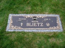 customized lawn-level memorial with bronze accents