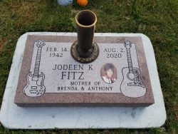 Customized memorial with engraved guitars