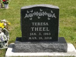 Customized upright memorial with engraved flowers and butterflies